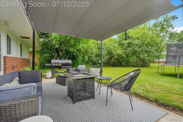 19425 Butternut Ln, Southfield, MI 48076 - view of patio featuring a trampoline and an outdoor living space with a fire pit