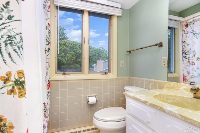 859 Foxboro Rd, Saginaw, MI 48638 - bathroom featuring vanity, tile walls, and wainscoting