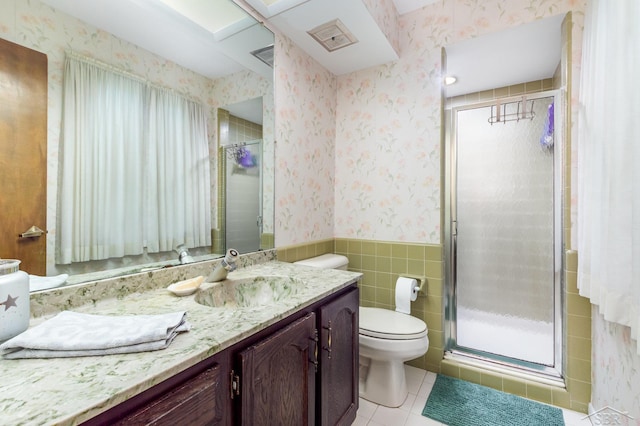 859 Foxboro Rd, Saginaw, MI 48638 - bathroom featuring wallpapered walls, vanity, tile patterned flooring, a wainscoted wall, and a stall shower