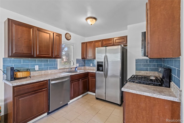 6329 Loraine St, Romulus, MI 48174 - kitchen featuring appliances with stainless steel finishes, tasteful backsplash, light countertops, and light tile patterned floors