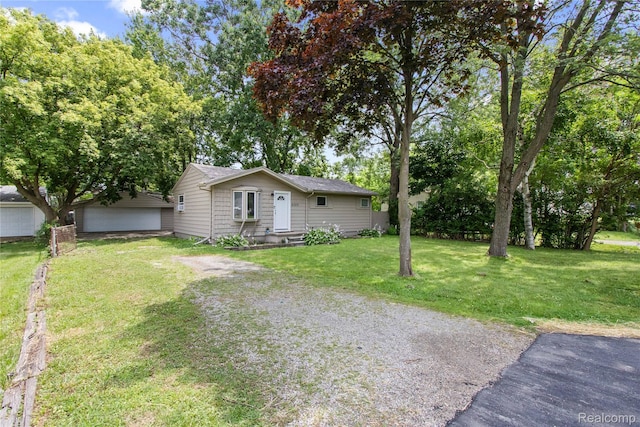 6329 Loraine St, Romulus, MI 48174 - view of side of home with a yard, driveway, and a garage