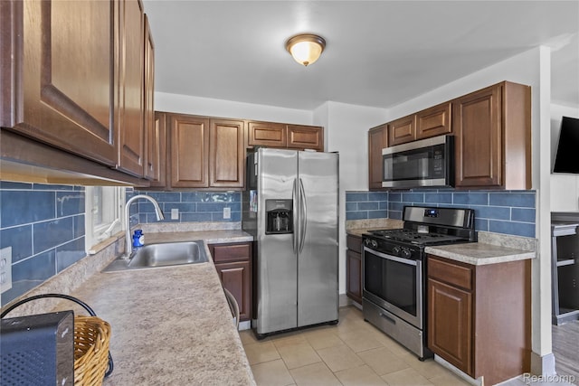 6329 Loraine St, Romulus, MI 48174 - kitchen featuring stainless steel appliances, light countertops, decorative backsplash, and light tile patterned floors