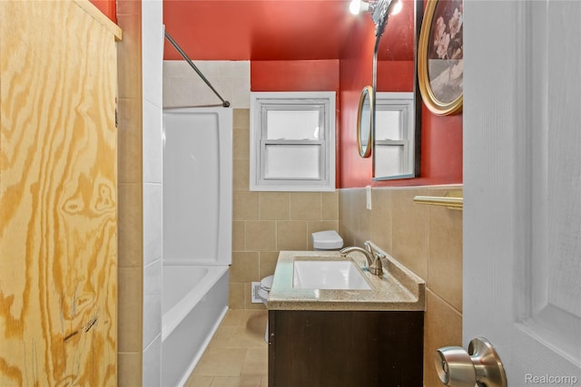 6329 Loraine St, Romulus, MI 48174 - bathroom featuring vanity, tile patterned flooring, bathtub / shower combination, and a wainscoted wall