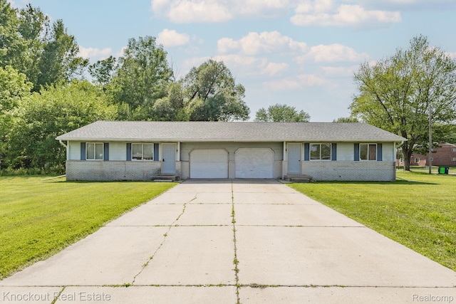 3782 Egan St, Saginaw, MI 48601 - single story home featuring an attached garage, brick siding, and a front lawn