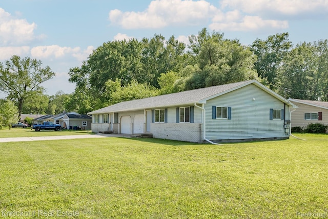 3782 Egan St, Saginaw, MI 48601 - ranch-style home featuring an attached garage, driveway, a front yard, and crawl space