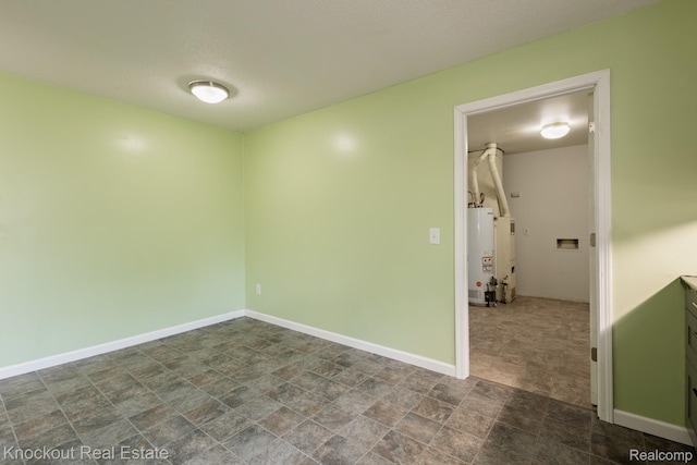 3782 Egan St, Saginaw, MI 48601 - unfurnished room featuring gas water heater and stone finish flooring