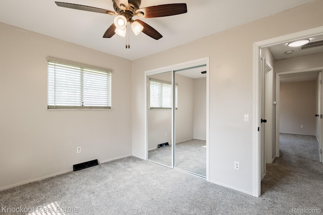 3782 Egan St, Saginaw, MI 48601 - unfurnished bedroom featuring carpet, a closet, and ceiling fan