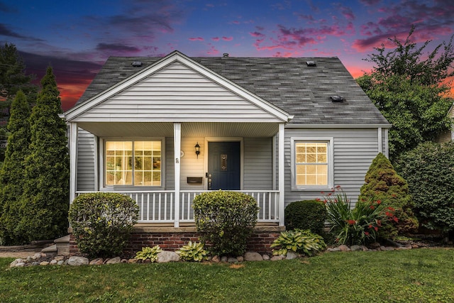 1018 S Stephenson Hwy, Royal Oak, MI 48067 - view of front of property featuring a porch, a shingled roof, and a front yard