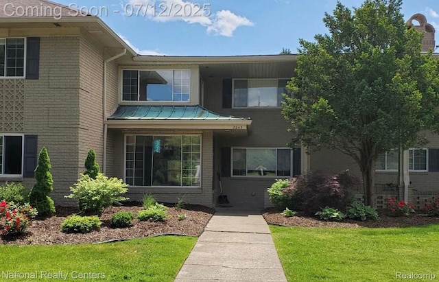 2245 S Walton Blvd Unit 58, Rochester Hills, MI 48309 - view of front of home with brick siding and a front yard