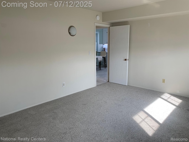 2245 S Walton Blvd Unit 58, Rochester Hills, MI 48309 - carpeted spare room featuring a smoke detector