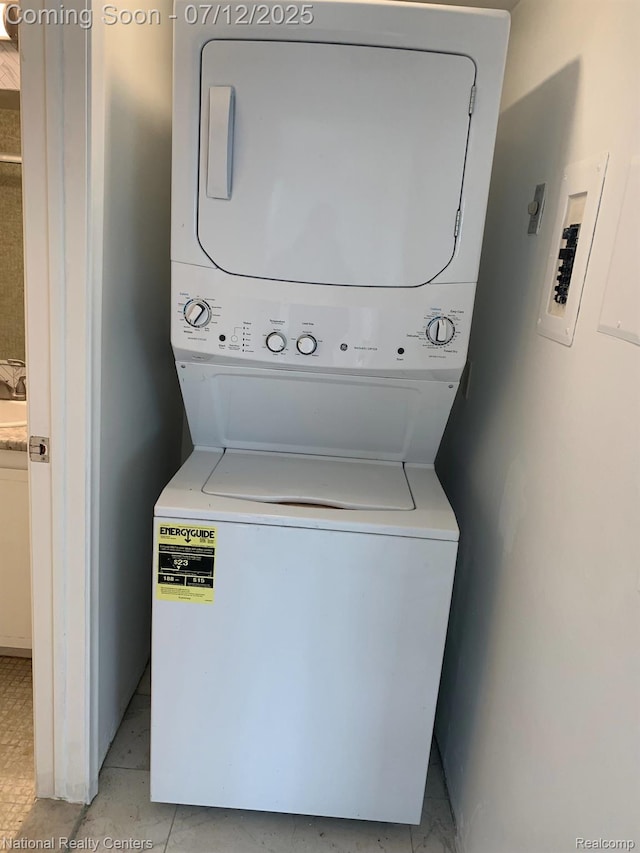 2245 S Walton Blvd Unit 58, Rochester Hills, MI 48309 - laundry area with stacked washing machine and dryer