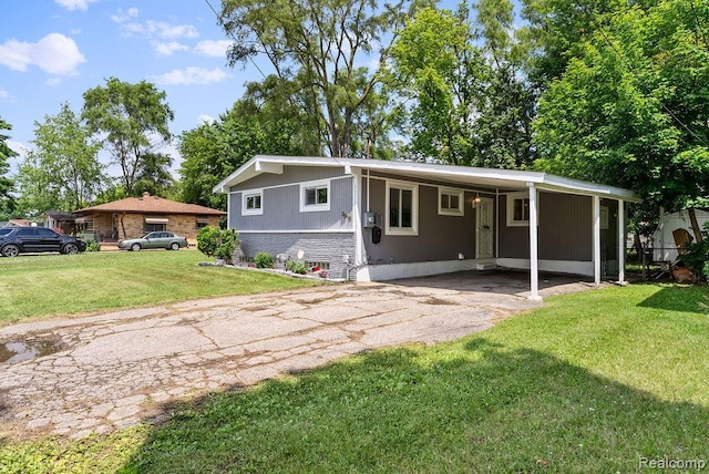 3818 Wisner St, Flint, MI 48504 - view of front of home featuring asphalt driveway, a front yard, and a carport