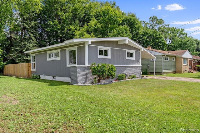 3818 Wisner St, Flint, MI 48504 - view of front facade with dirt driveway and brick siding