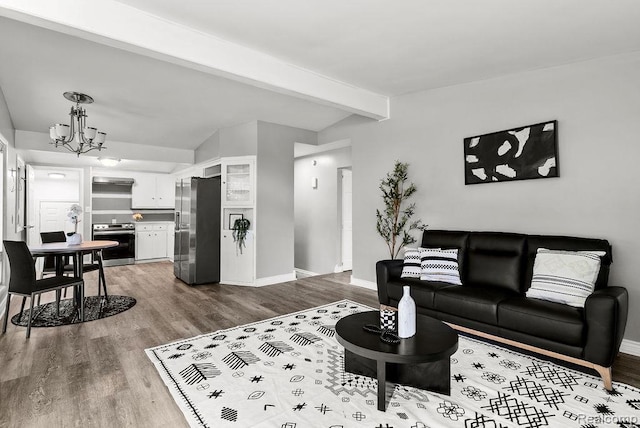 3818 Wisner St, Flint, MI 48504 - living area featuring a chandelier and wood finished floors