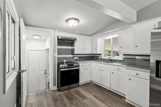 3818 Wisner St, Flint, MI 48504 - kitchen with appliances with stainless steel finishes, vaulted ceiling, white cabinets, dark wood finished floors, and wall chimney exhaust hood