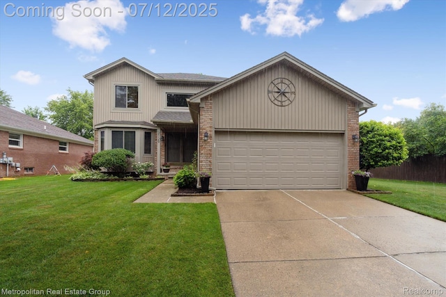 2129 Camelot Dr, Troy, MI 48083 - view of front facade featuring brick siding, driveway, a front lawn, and an attached garage