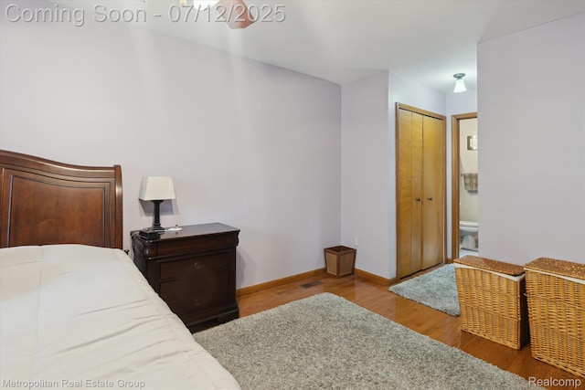 2129 Camelot Dr, Troy, MI 48083 - bedroom featuring wood finished floors and baseboards