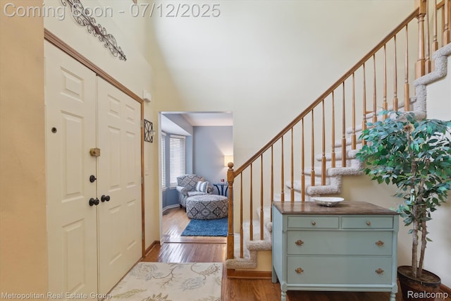 2129 Camelot Dr, Troy, MI 48083 - foyer with wood finished floors, stairs, and a towering ceiling