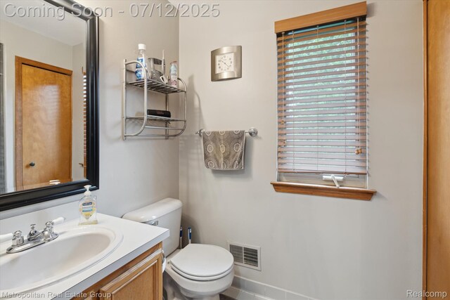2129 Camelot Dr, Troy, MI 48083 - half bath with vanity and toilet