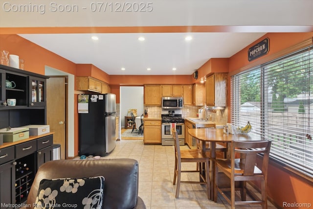 2129 Camelot Dr, Troy, MI 48083 - kitchen featuring appliances with stainless steel finishes, tasteful backsplash, light countertops, and light tile patterned flooring