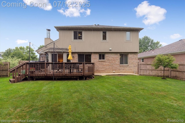 2129 Camelot Dr, Troy, MI 48083 - back of house featuring brick siding, a fenced backyard, and a deck