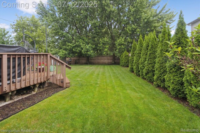 2129 Camelot Dr, Troy, MI 48083 - view of yard featuring a wooden deck