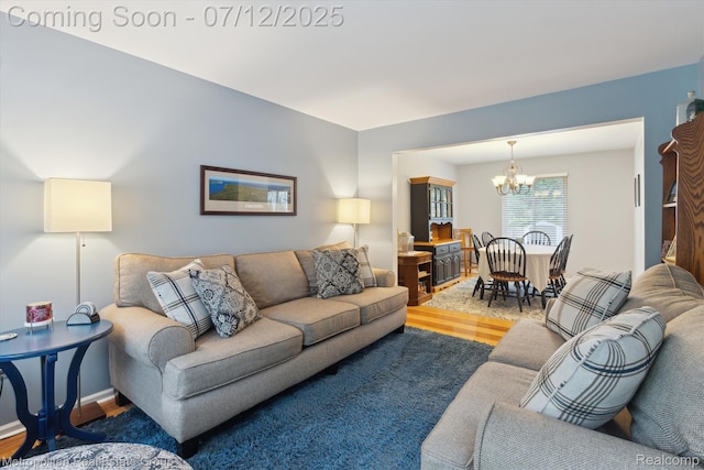 2129 Camelot Dr, Troy, MI 48083 - living area with wood finished floors and a chandelier