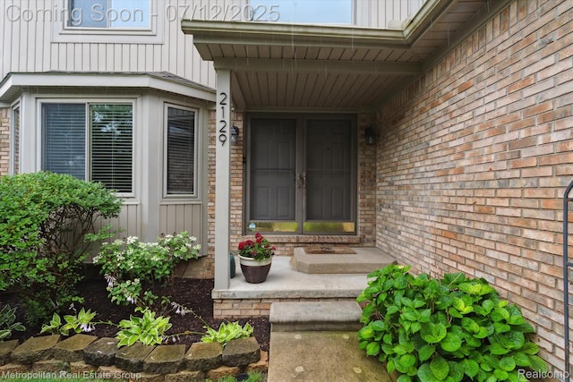 2129 Camelot Dr, Troy, MI 48083 - property entrance with board and batten siding and brick siding
