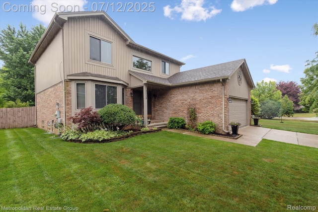 2129 Camelot Dr, Troy, MI 48083 - view of front of property featuring brick siding, driveway, a garage, and a shingled roof
