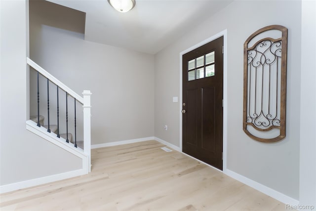 11879 Secluded Ridge Dr, Byron, MI 48418 - foyer featuring wood finished floors and stairs