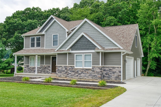 11879 Secluded Ridge Dr, Byron, MI 48418 - craftsman-style home with concrete driveway, covered porch, a front yard, a shingled roof, and an attached garage