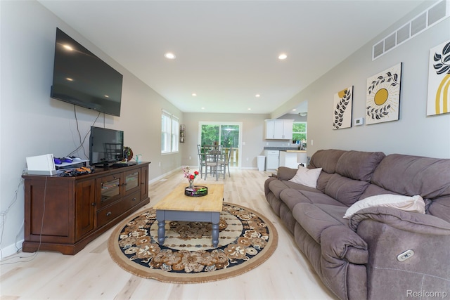 11879 Secluded Ridge Dr, Byron, MI 48418 - living room with light wood-style floors and recessed lighting