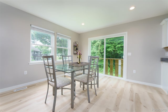 11879 Secluded Ridge Dr, Byron, MI 48418 - dining area with light wood finished floors and recessed lighting