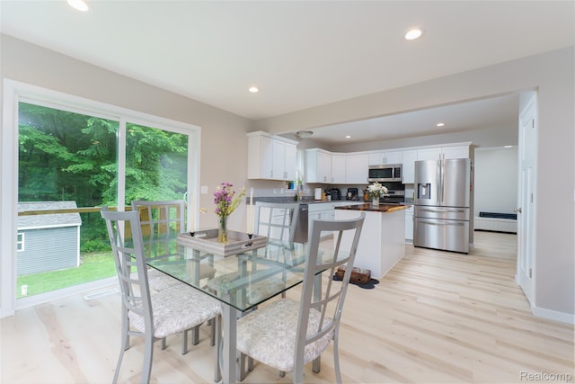 11879 Secluded Ridge Dr, Byron, MI 48418 - dining room featuring light wood-type flooring and recessed lighting