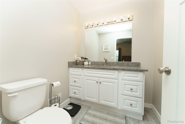 11879 Secluded Ridge Dr, Byron, MI 48418 - bathroom with vanity and wood finished floors