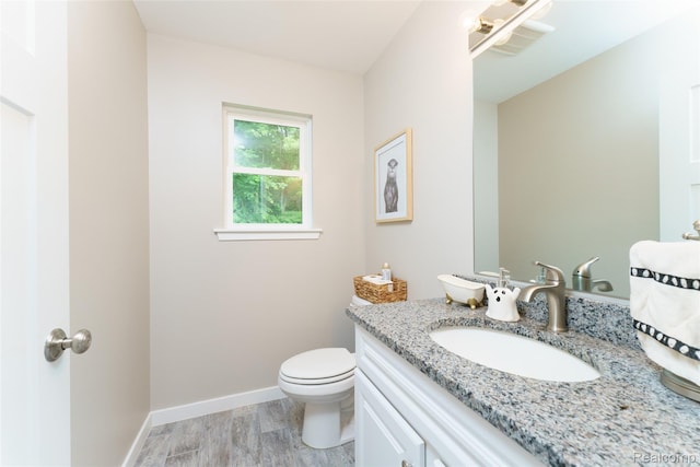 11879 Secluded Ridge Dr, Byron, MI 48418 - bathroom featuring vanity and wood finished floors