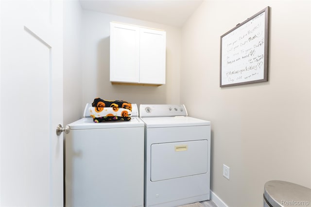 11879 Secluded Ridge Dr, Byron, MI 48418 - laundry area featuring separate washer and dryer and cabinet space
