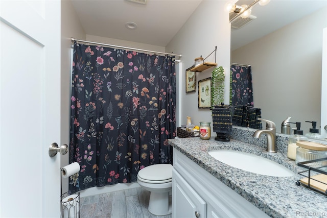 11879 Secluded Ridge Dr, Byron, MI 48418 - full bathroom with vanity, wood finished floors, and a shower with curtain