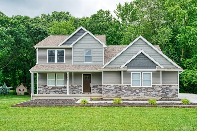 11879 Secluded Ridge Dr, Byron, MI 48418 - craftsman-style home featuring a front yard, a porch, a shingled roof, and stone siding