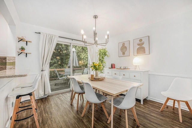 4649 Northview Ave NE, Grand Rapids, MI 49525 - dining room featuring a chandelier and dark wood-style flooring