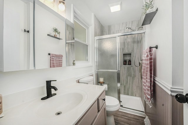4649 Northview Ave NE, Grand Rapids, MI 49525 - full bath with a stall shower, vanity, and wood finished floors