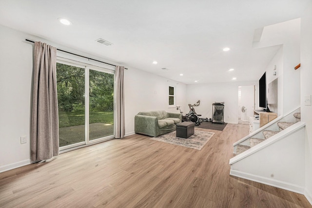 4649 Northview Ave NE, Grand Rapids, MI 49525 - living area with wood finished floors, recessed lighting, and stairway