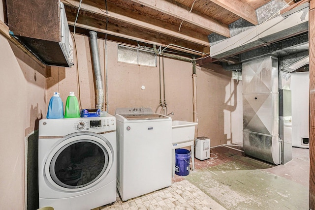 4649 Northview Ave NE, Grand Rapids, MI 49525 - laundry room with independent washer and dryer and heating unit