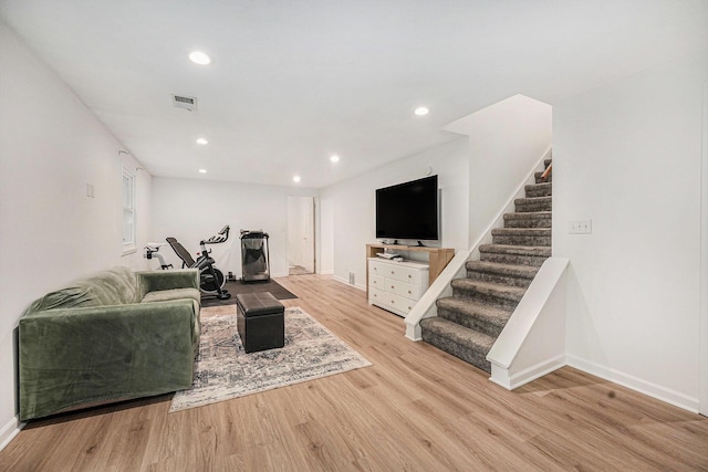 4649 Northview Ave NE, Grand Rapids, MI 49525 - living room featuring wood finished floors, stairs, and recessed lighting