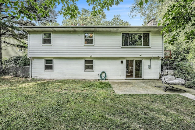 4649 Northview Ave NE, Grand Rapids, MI 49525 - back of property with a patio and a chimney
