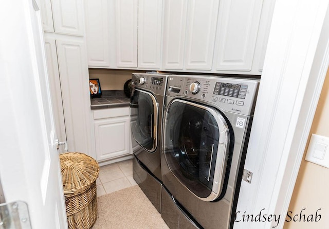13025 Shaner Ave NE, Cedar Springs, MI 49319 - laundry room featuring cabinet space, washing machine and clothes dryer, and light tile patterned floors