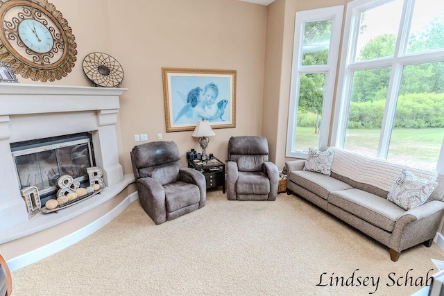 13025 Shaner Ave NE, Cedar Springs, MI 49319 - living room featuring carpet, healthy amount of natural light, and a glass covered fireplace