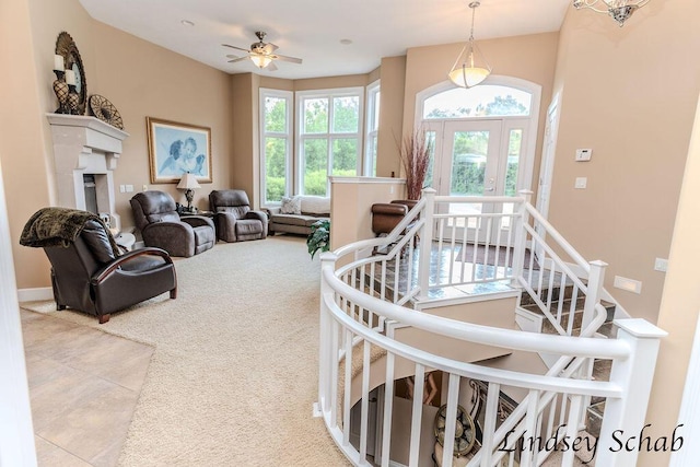 13025 Shaner Ave NE, Cedar Springs, MI 49319 - living area with carpet flooring, tile patterned flooring, a fireplace, and ceiling fan