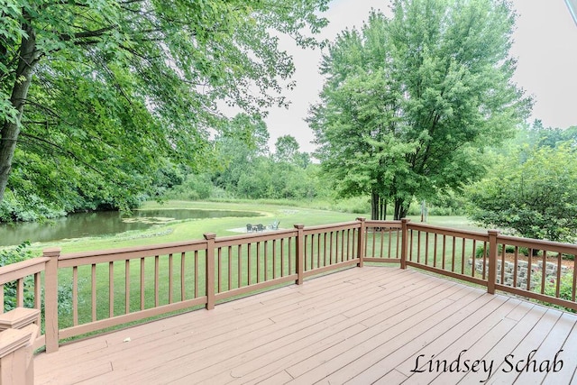 13025 Shaner Ave NE, Cedar Springs, MI 49319 - wooden deck with a water view and a lawn