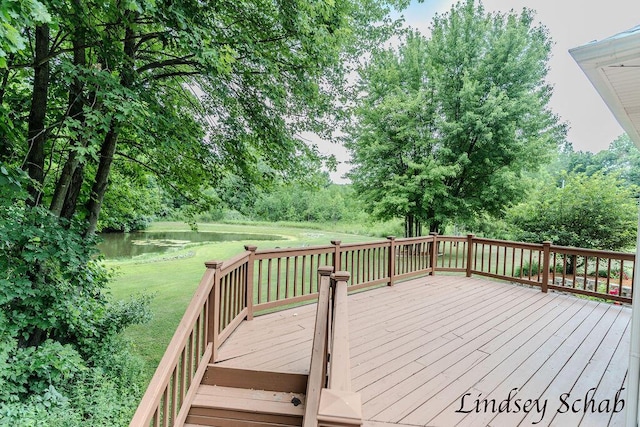 13025 Shaner Ave NE, Cedar Springs, MI 49319 - wooden terrace featuring a water view and a lawn